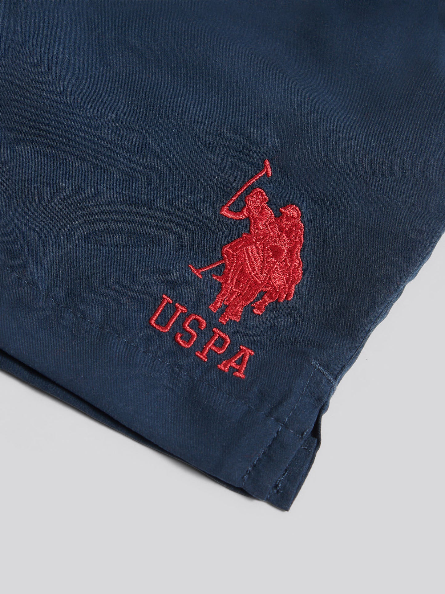 Boys Player 3 Swim Short in Dark Sapphire Navy / Haute Red DHM