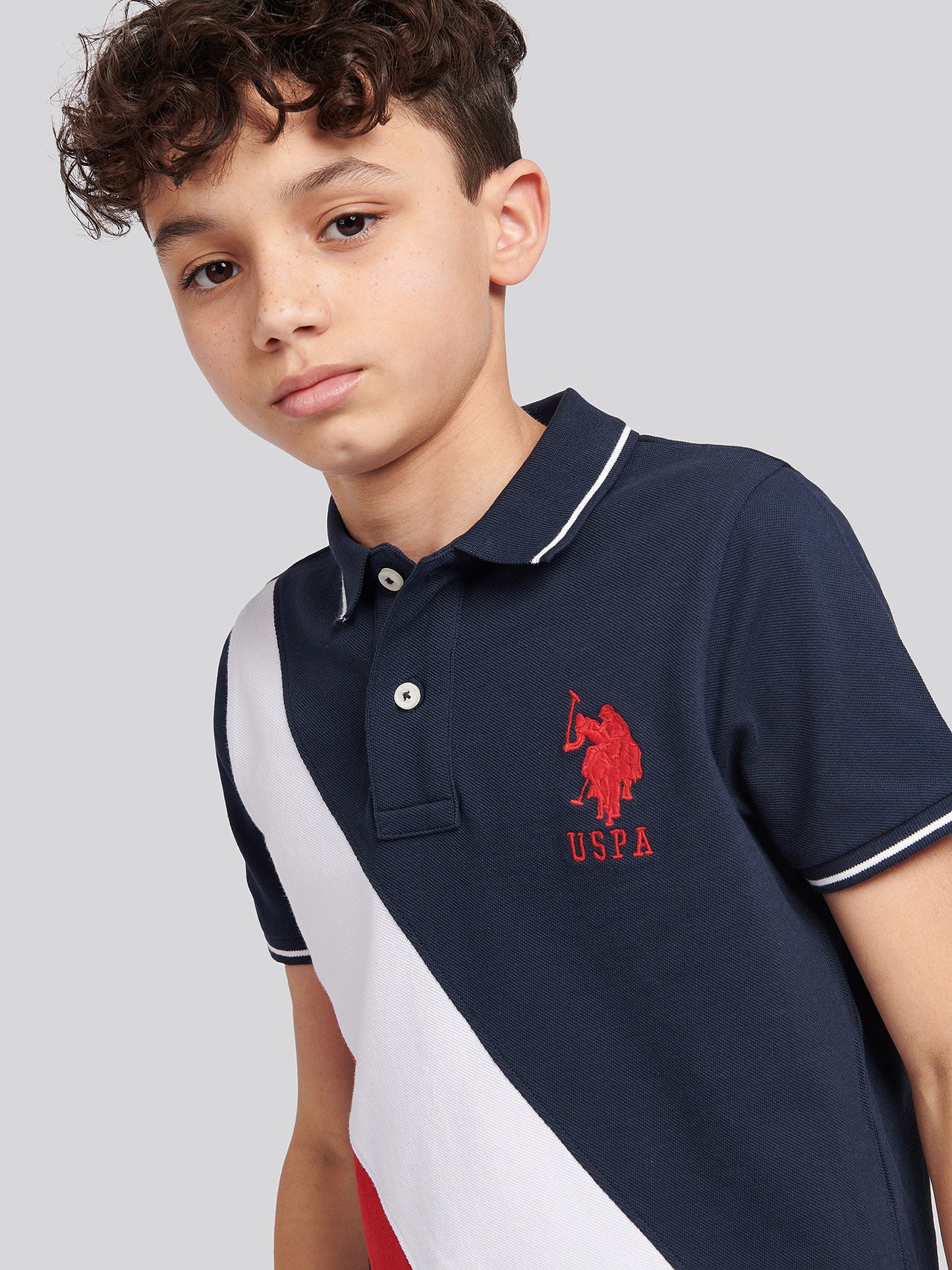 Boys Player 3 Sash Polo Shirt in Dark Sapphire Navy / Haute Red DHM