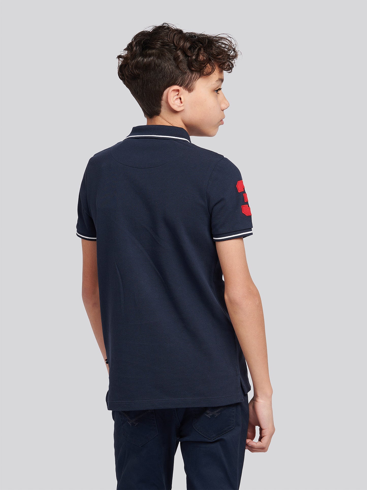 Boys Player 3 Sash Polo Shirt in Dark Sapphire Navy / Haute Red DHM