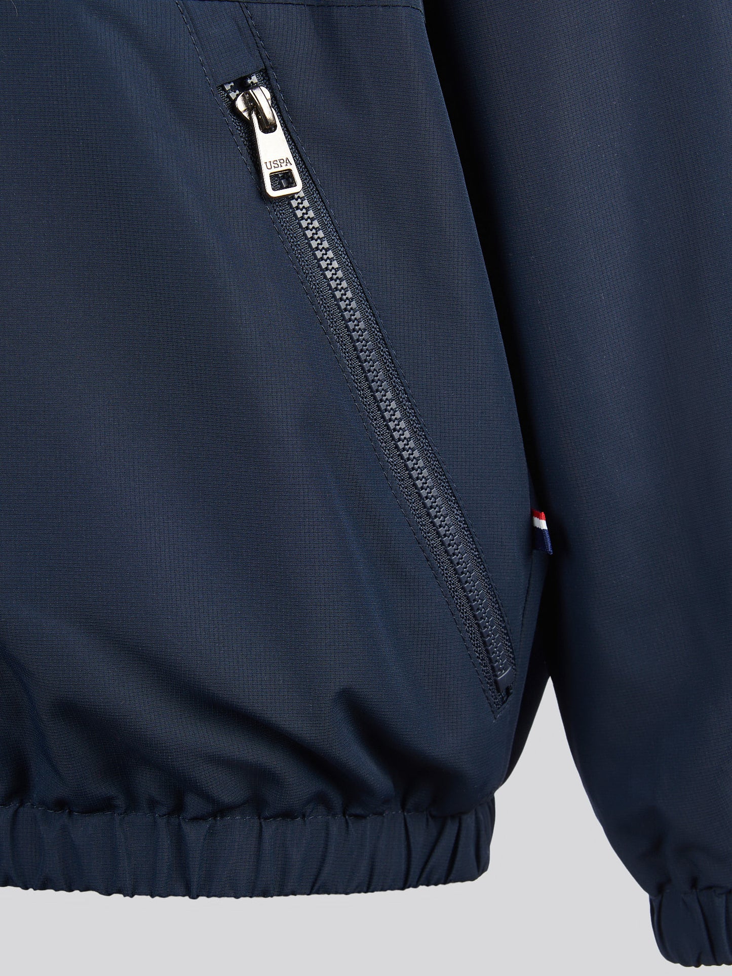 Boys Fleece Lined Windcheater in Dark Sapphire Navy / Haute Red DHM