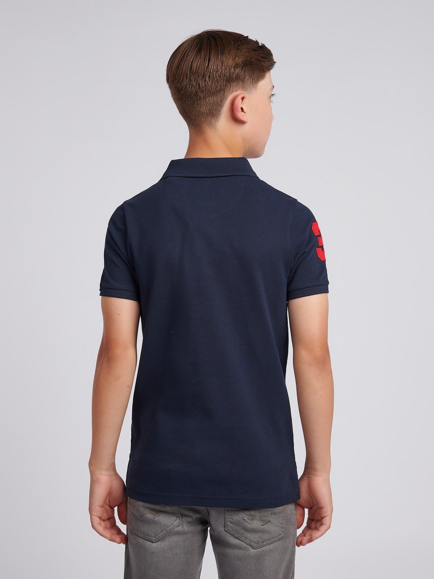 Boys Player 3 Polo Shirt in Dark Sapphire Navy / Haute Red DHM