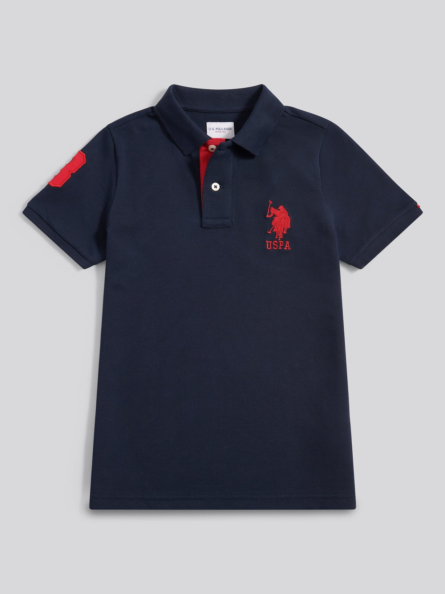 Boys Player 3 Polo Shirt in Dark Sapphire Navy / Haute Red DHM